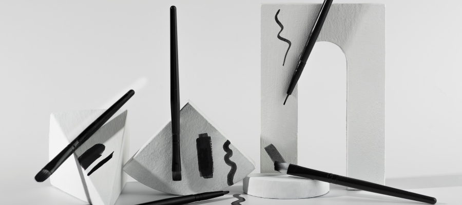 A branded gazebo with pull-up banners and teardrop banners at a pop-up event